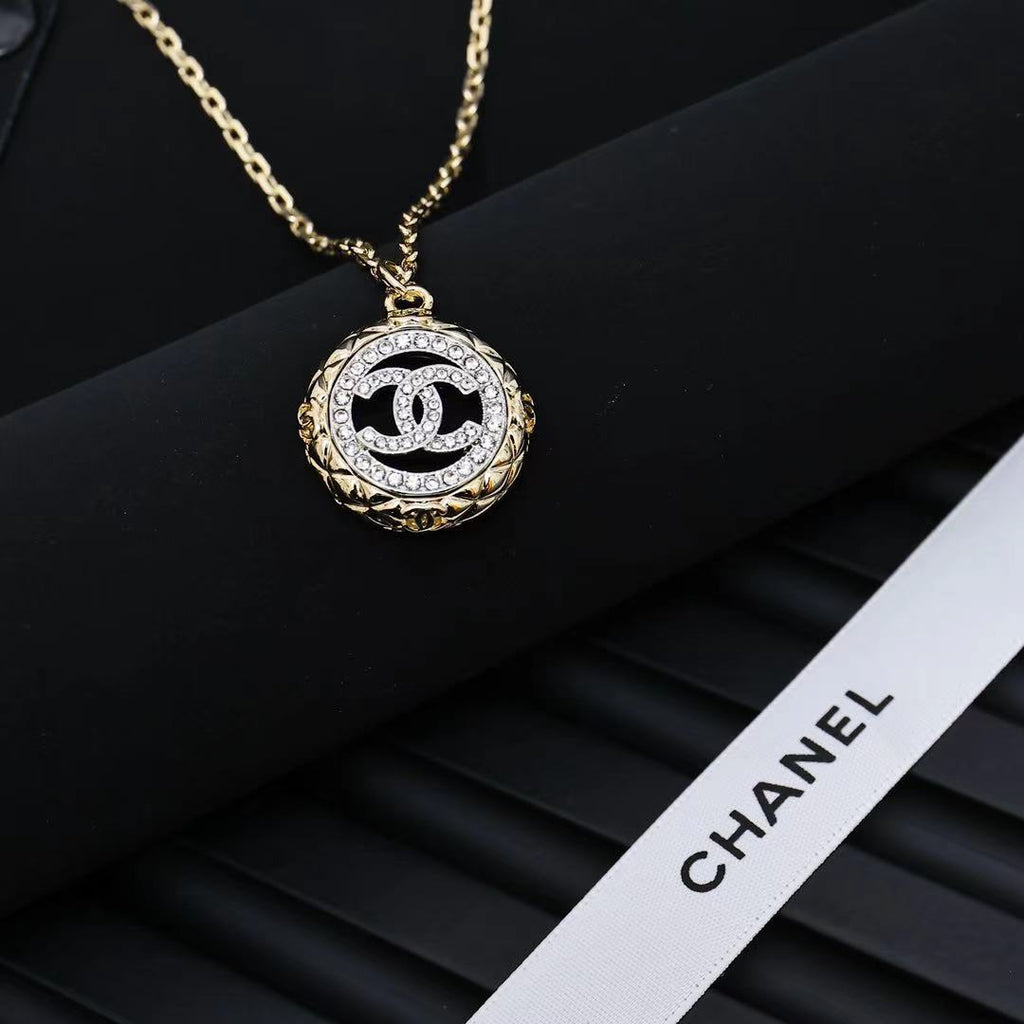 Gold-tone Chanel CC pendant necklace with oval crystal-studded medallion