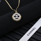 Gold-tone Chanel CC pendant necklace with oval crystal-studded medallion