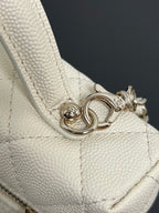 Chanel charm clasp on quilted cream leather, silver-tone hardware detail