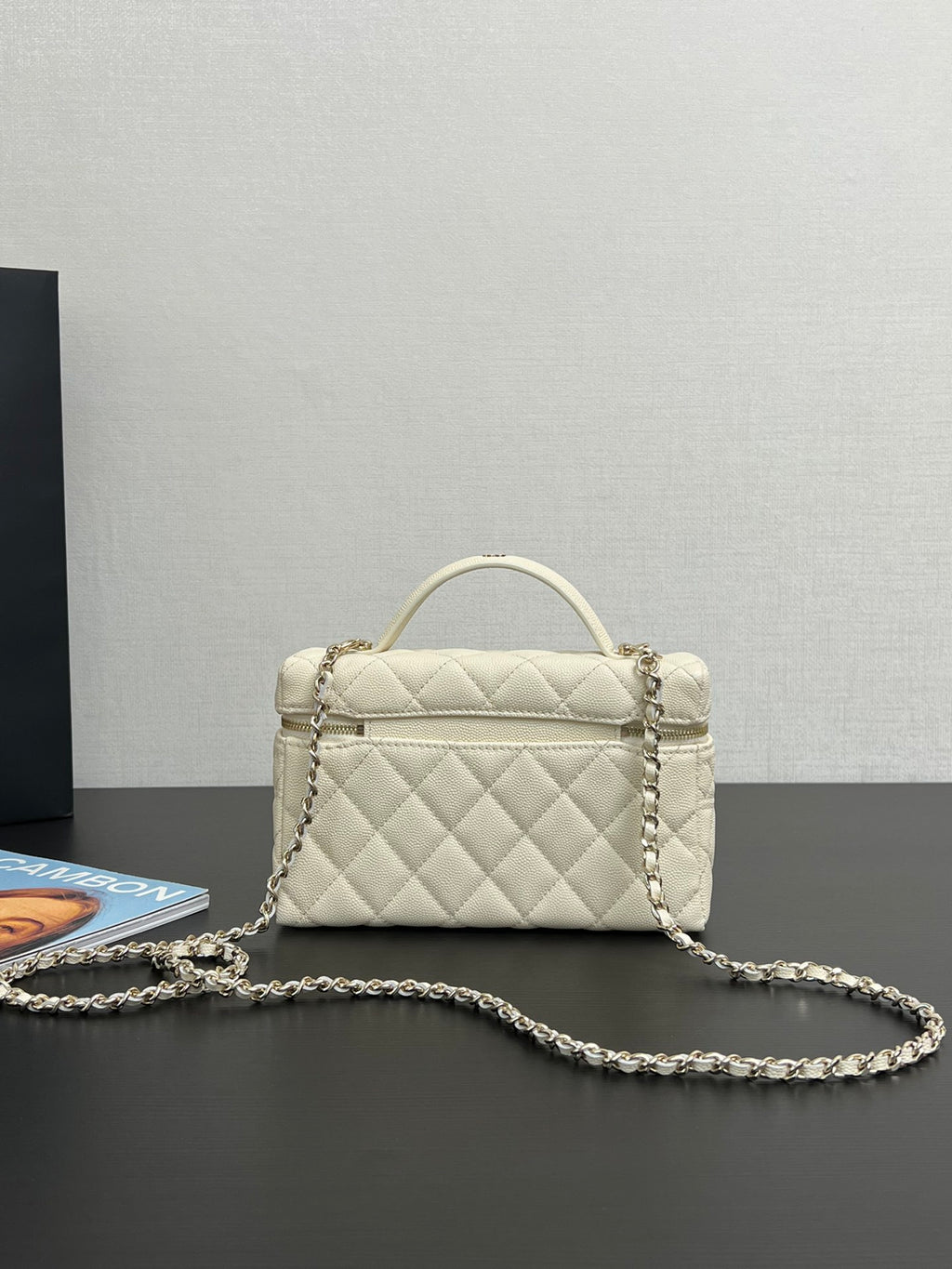 Chanel quilted leather mini bag, cream, front view with chain strap