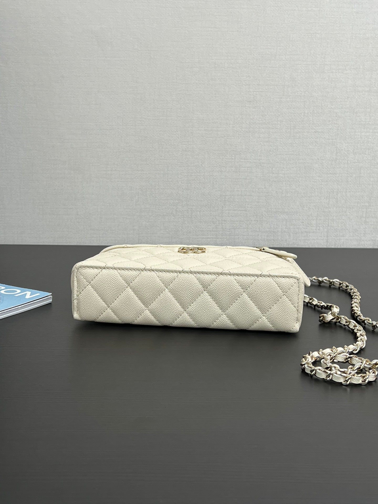 Chanel quilted leather mini bag, cream, back view with chain strap