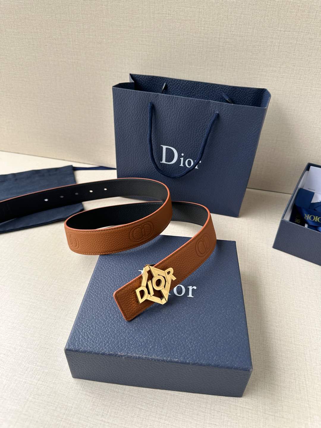 Dior belt with tan leather strap and gold-tone logo buckle