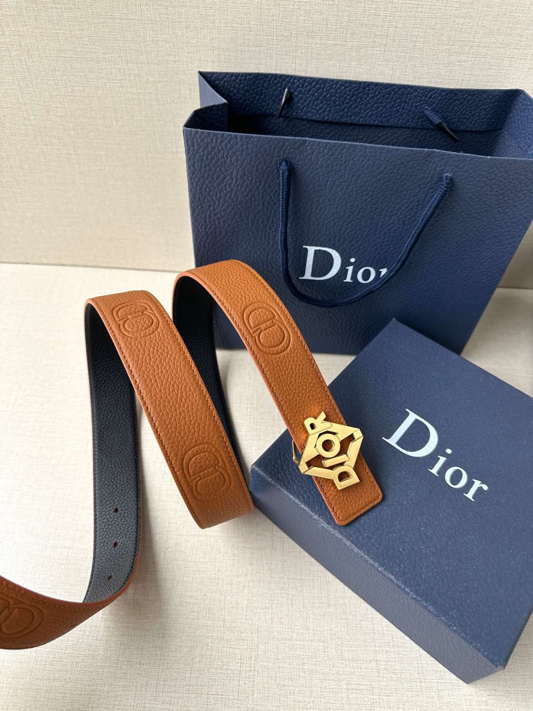 Dior belt, tan leather strap with gold-tone logo buckle and embossed details
