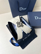 Ivory leather belt with dark Dior buckle and textured strap