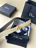 Ivory Dior belt with textured strap and gold-tone logo buckle