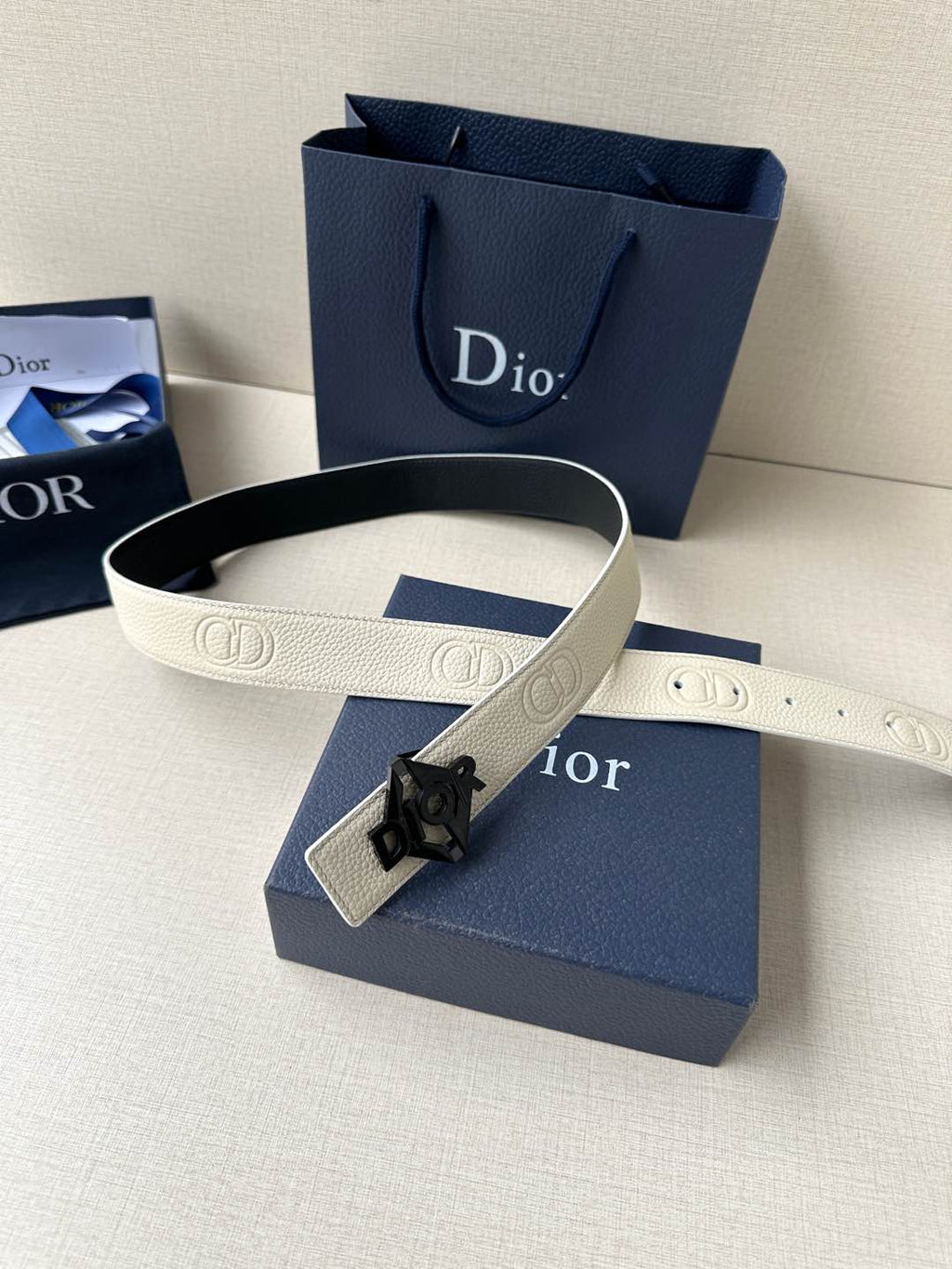 Ivory leather belt with textured logo strap and dark Dior buckle
