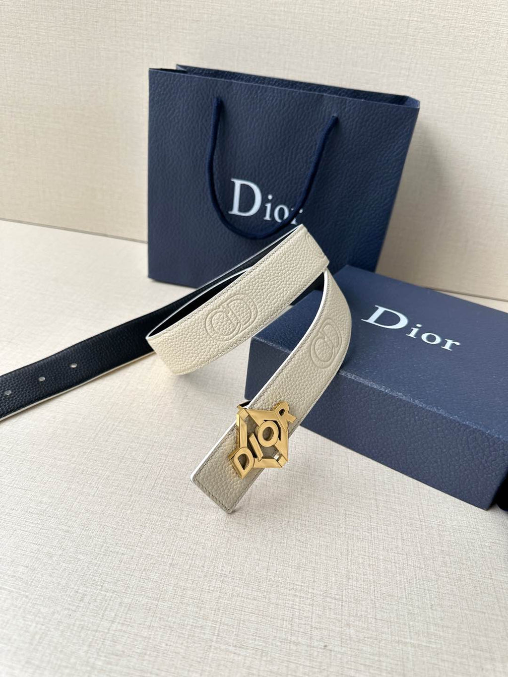 Ivory leather belt with gold Dior logo buckle and textured strap