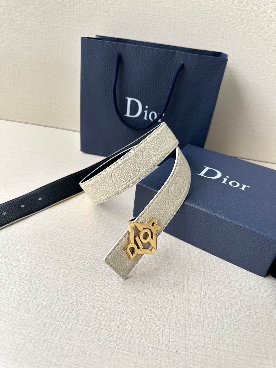 Ivory leather belt with gold Dior logo buckle and textured strap