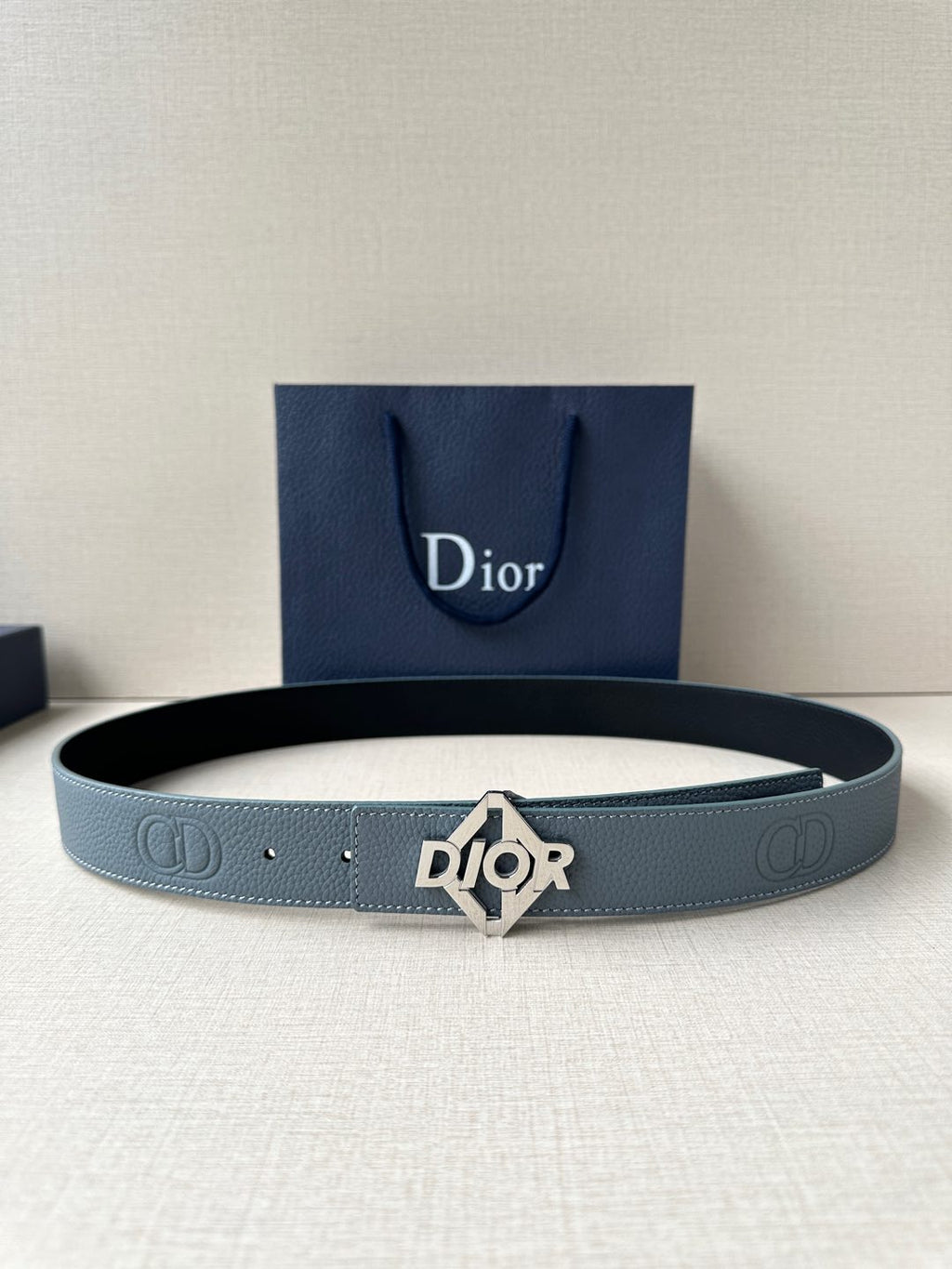 Dior belt in light blue leather with silver buckle and embossed logo details