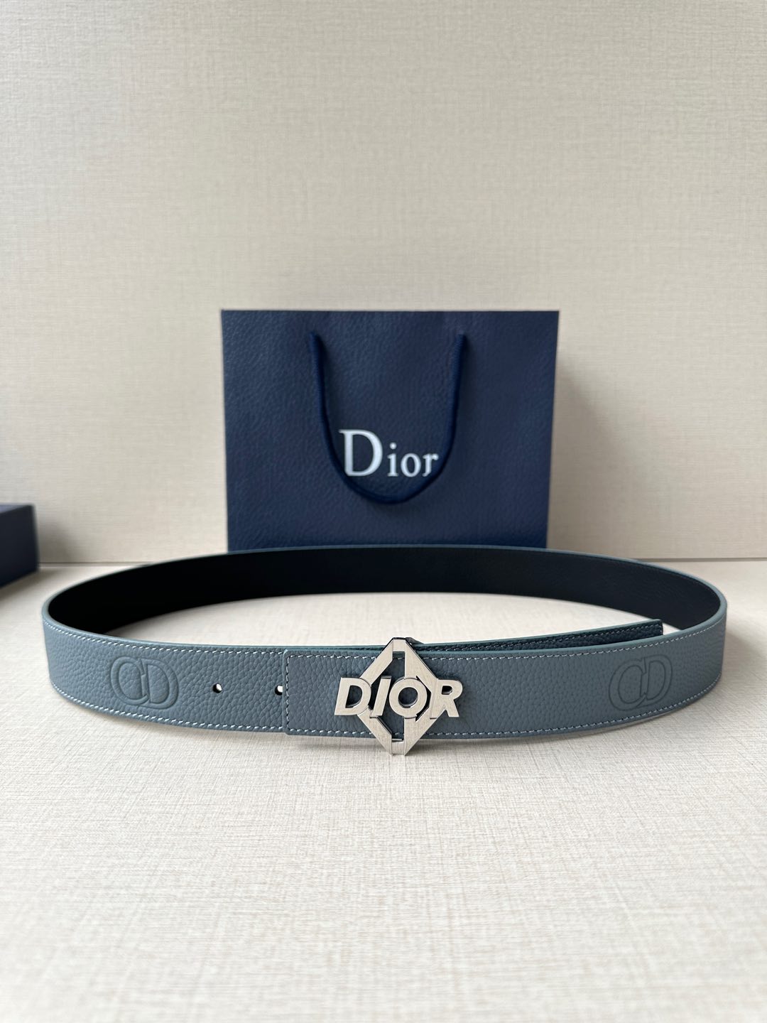 Dior belt in light blue leather with silver buckle and embossed logo details