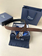 Dior belt with brown leather strap and gold-tone Dior logo buckle.