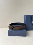 Dior belt with dark brown leather strap and gold-tone Dior logo buckle.