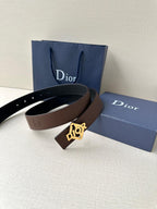 Dior belt on display: dark brown leather strap with gold-tone Dior buckle.