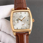 Rectangular dial wristwatch with brown leather strap, gold-tone case, diamond markers