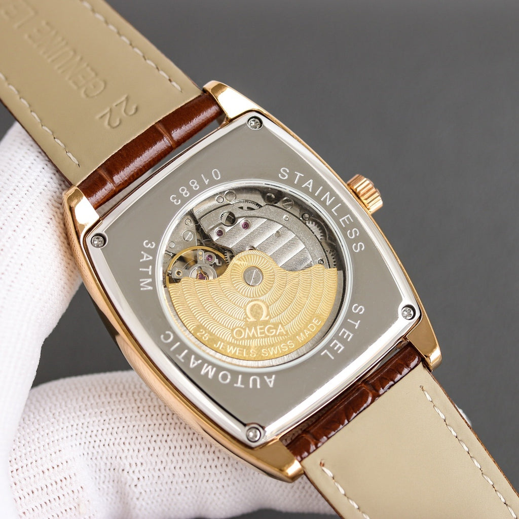 Skeleton-style caseback wristwatch with brown leather strap and gold-tone frame