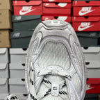 White sneaker heel with padded collar and textured mesh upper