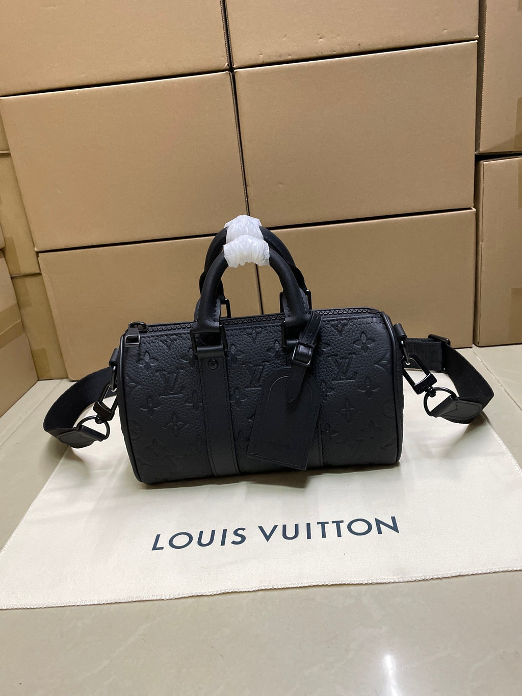 Louis Vuitton monogram duffel bag, dark leather, top handles and shoulder strap