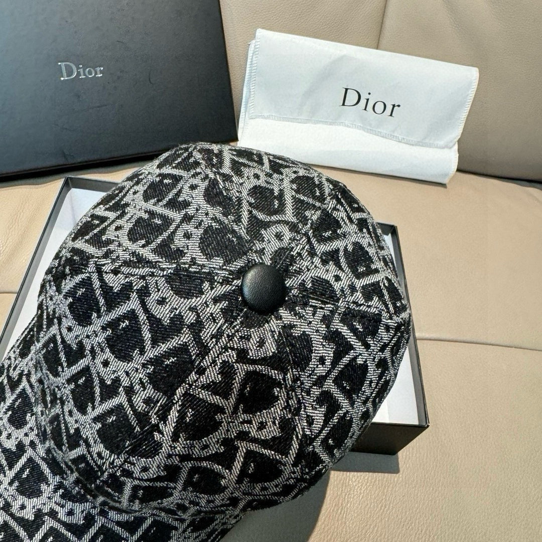 Black-and-white patterned baseball cap with round top button and curved brim