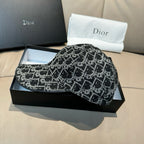 Black-and-white patterned baseball cap with curved brim, side profile on box