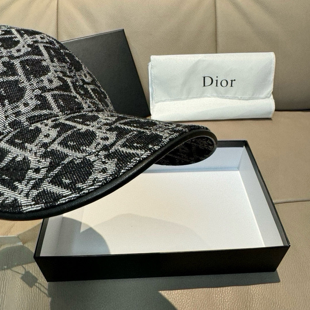 Black-and-white patterned baseball cap brim close-up with curved front edge