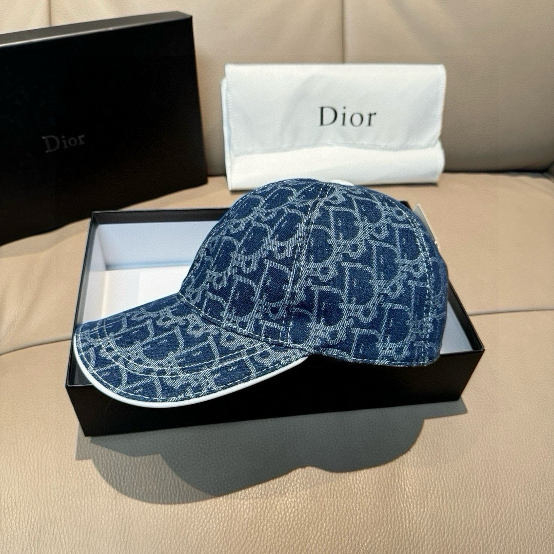 Dior logo-print denim cap in dark blue, front view with curved brim.