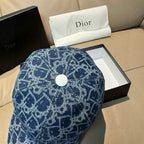 Dior logo-print denim cap in dark blue, top view with white snap button.