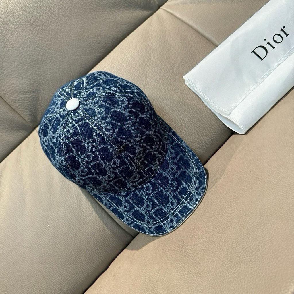 Dior logo-print denim cap in dark blue with white snap button on top.