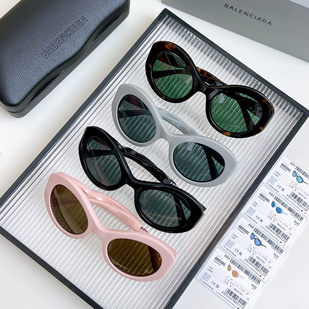 Balenciaga sunglasses set with pink, black, white, and tortoiseshell frames