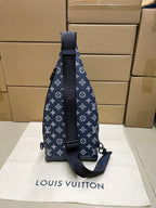 Men's navy monogram sling bag with adjustable strap and back zip pocket