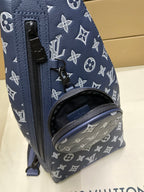 Louis Vuitton monogram bag front detail in navy with zip closure and logo pattern
