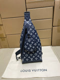 Men's navy monogram hobo bag with top handle and shoulder strap, zip closure