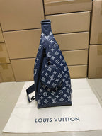 Louis Vuitton monogram handbag in navy with short top handle and shoulder strap