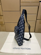 Louis Vuitton monogram tote in navy with long shoulder strap and side zipper pocket