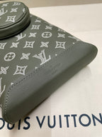 Louis Vuitton monogram sling bag detail, olive green trim and visible stitching