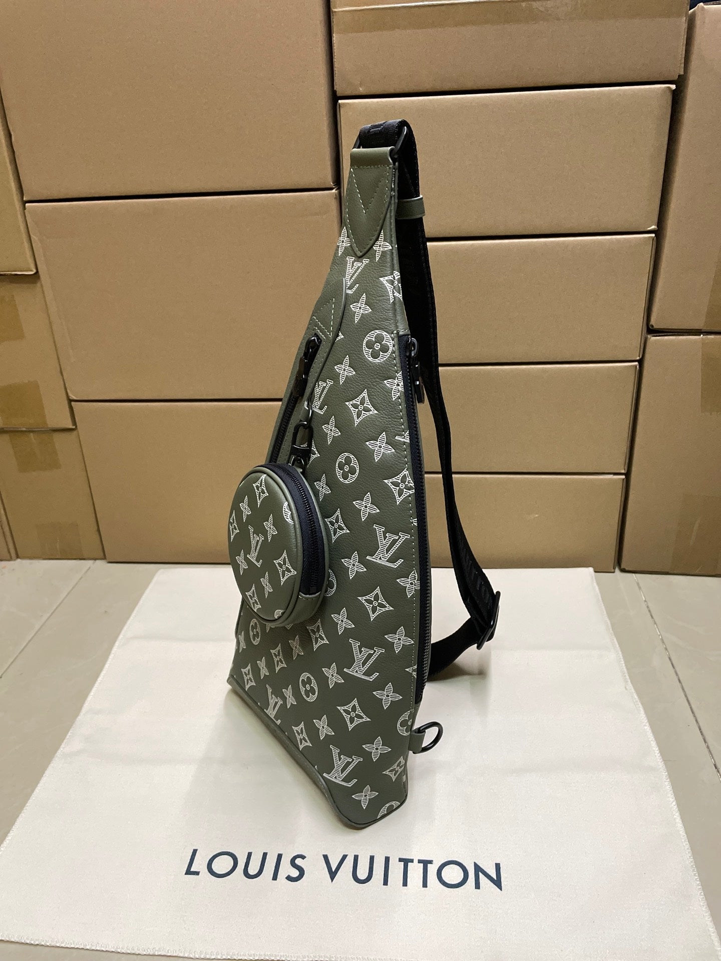 Louis Vuitton men's sling bag, dark olive monogram with crossbody strap and front zipper