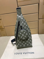 Louis Vuitton monogram mini sling bag in olive green, front view with strap