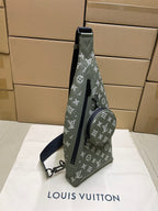 Louis Vuitton monogram sling bag in olive green, angled view with front zipper pocket