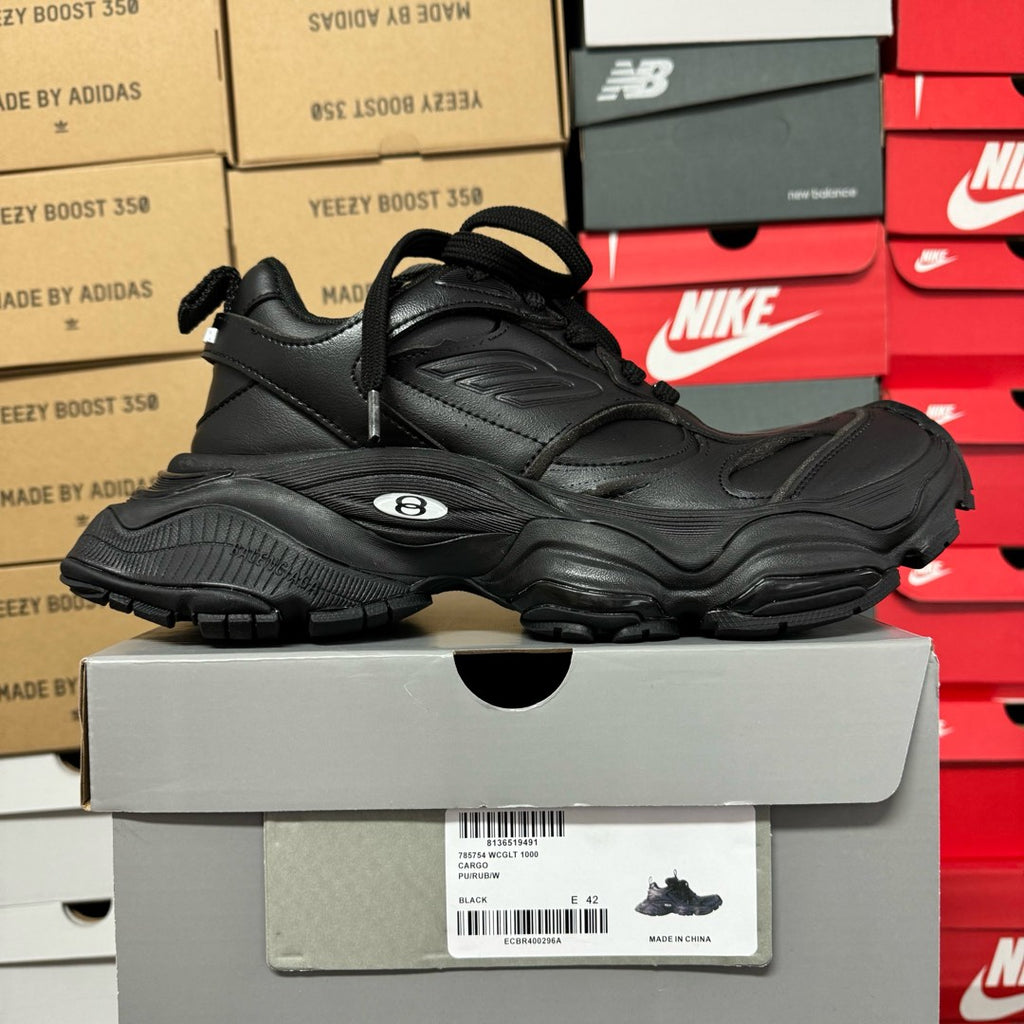 Black Balenciaga unisex chunky sneakers, side view with lace-up tongue and thick sole