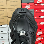 Black Balenciaga unisex sneaker toe and lace area, close-up with logo patch
