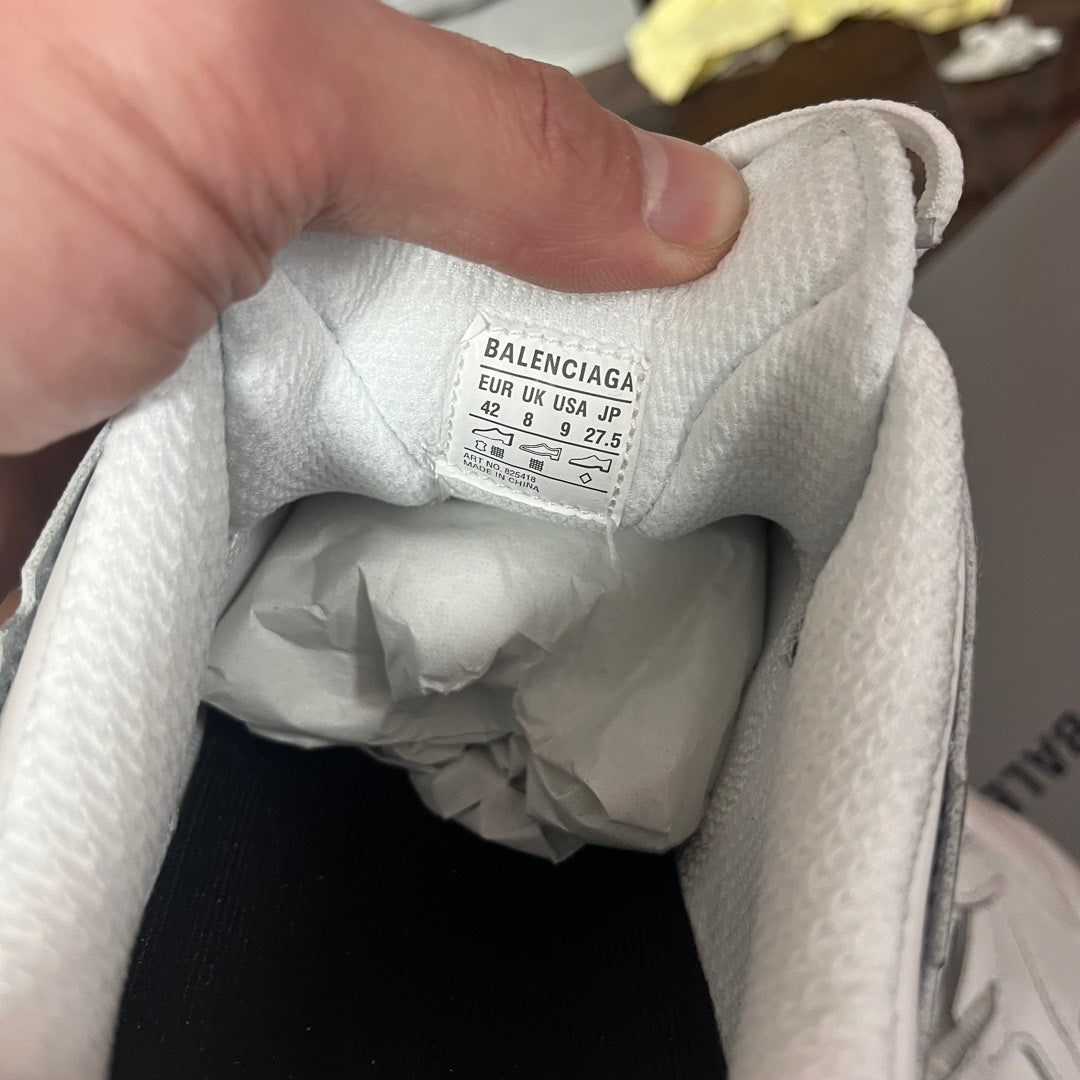 White sneaker interior showing size label reading BALENCIAGA