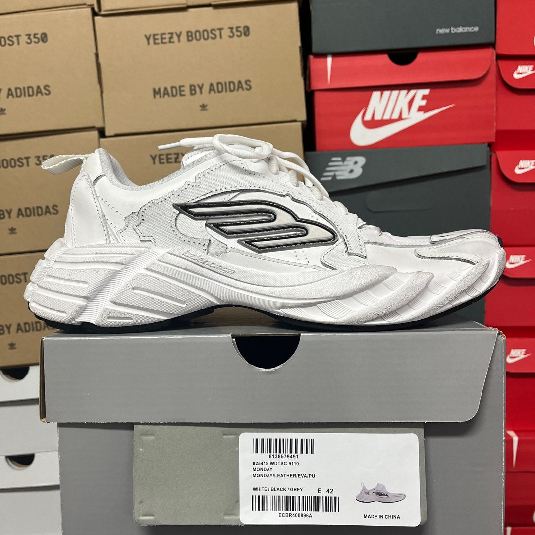 White lace-up athletic sneaker with side logo panel and ribbed midsole
