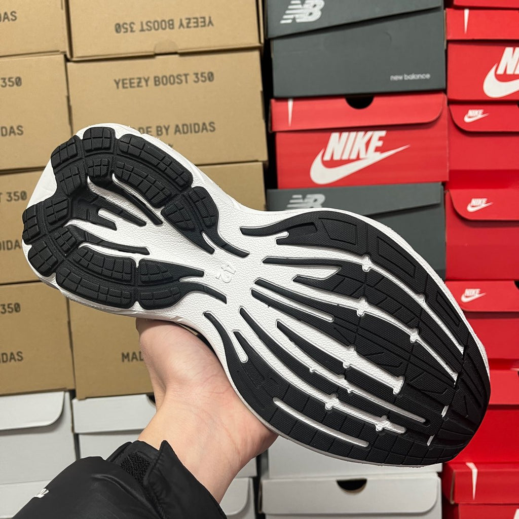 White sneaker outsole with black traction tread pattern
