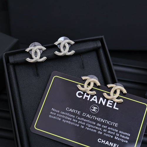 Silver-tone Chanel CC stud earrings with rhinestone detail in black gift box