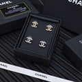 Set of four silver-tone Chanel CC stud earrings with rhinestone accents in box