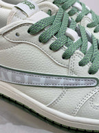 Burberry sneaker side close-up, white leather with green laces and stitched swoosh