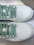 Burberry sneakers toe close-up, white perforated leather with green laces and sole