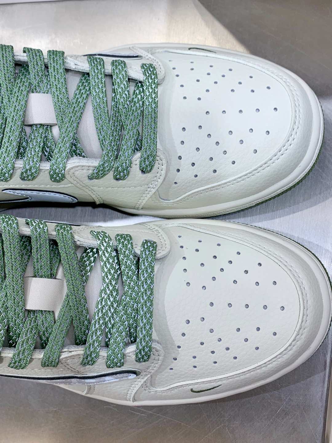 Burberry sneakers toe close-up, white perforated leather with green laces and sole