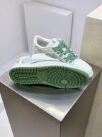 Burberry sneakers on box, white with green laces and textured green rubber outsole