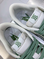 Burberry sneakers tongue close-up, white padding with green logo and lace