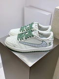 Burberry sneakers in white with green laces and perforated toe, front view pair